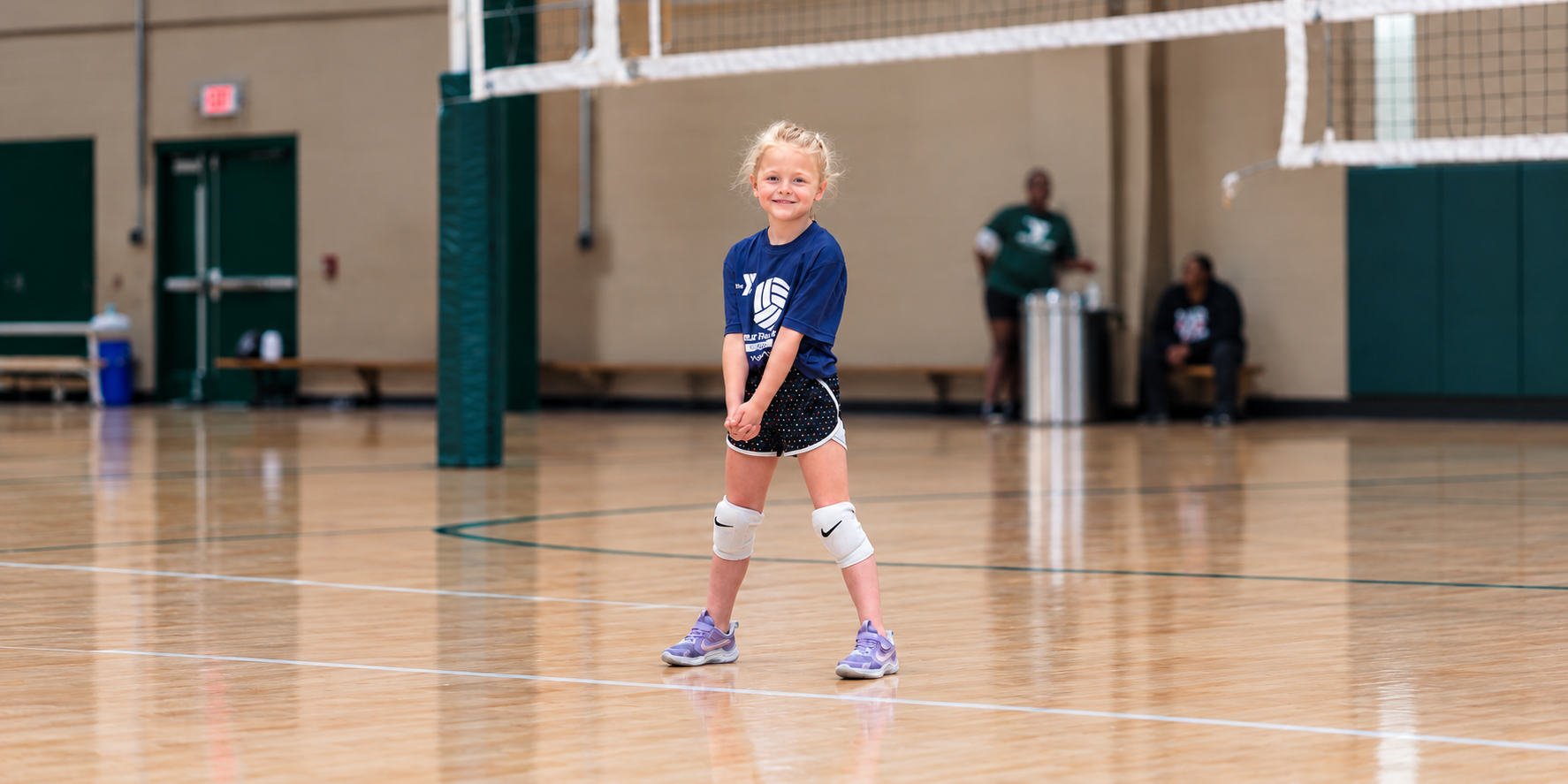 Smiling Young Volleyball Player on Court (1)